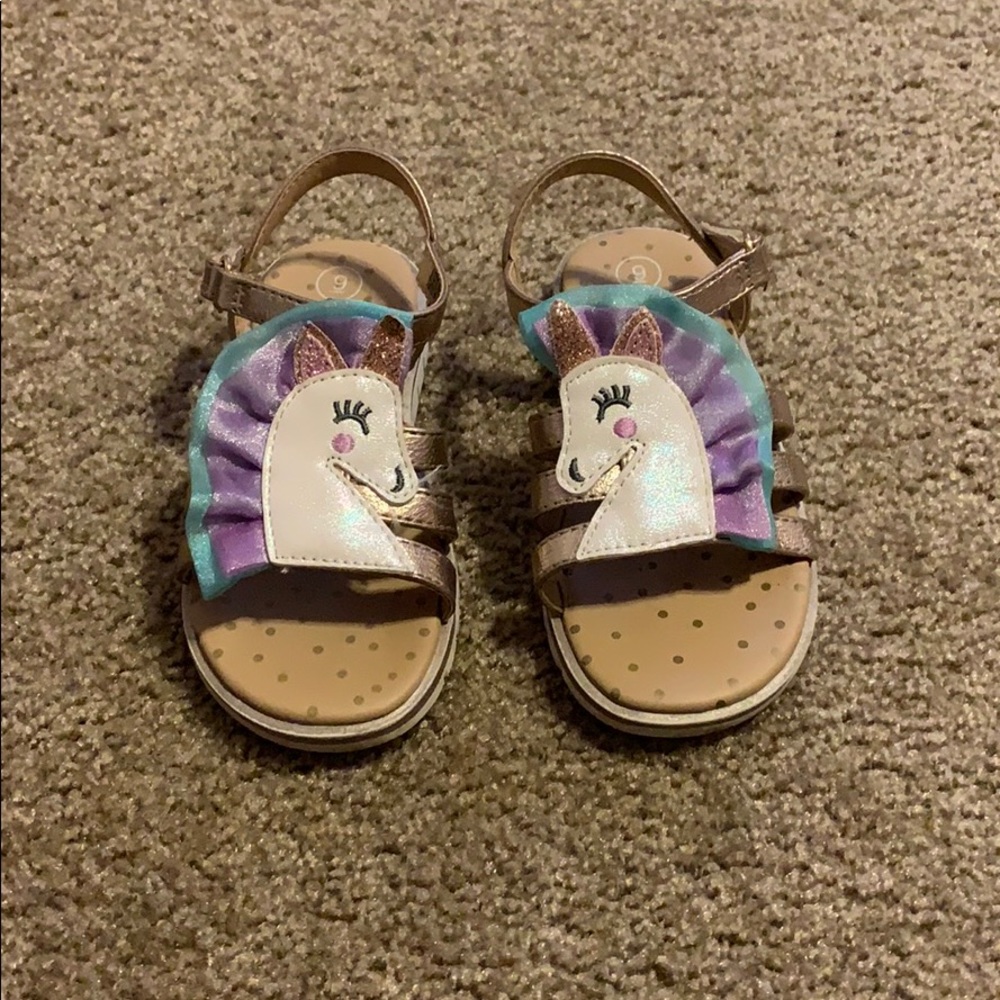 Sandals with unicorn detail.